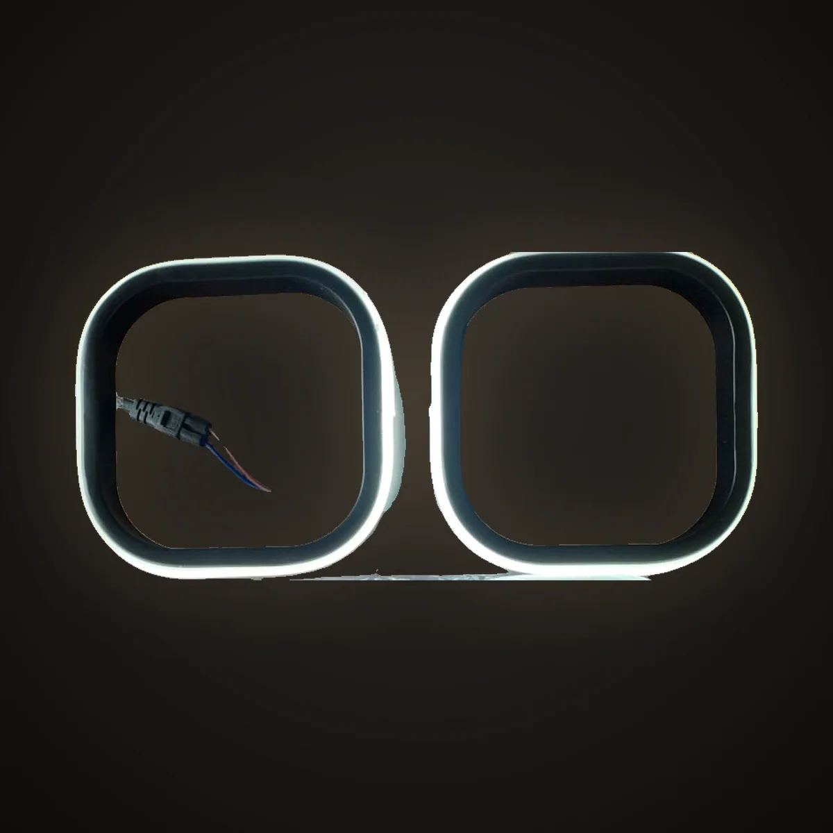 Twin square halo wall light glowing